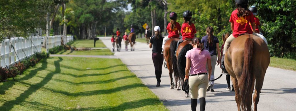 Kids riding horses at Pine Hollow camp