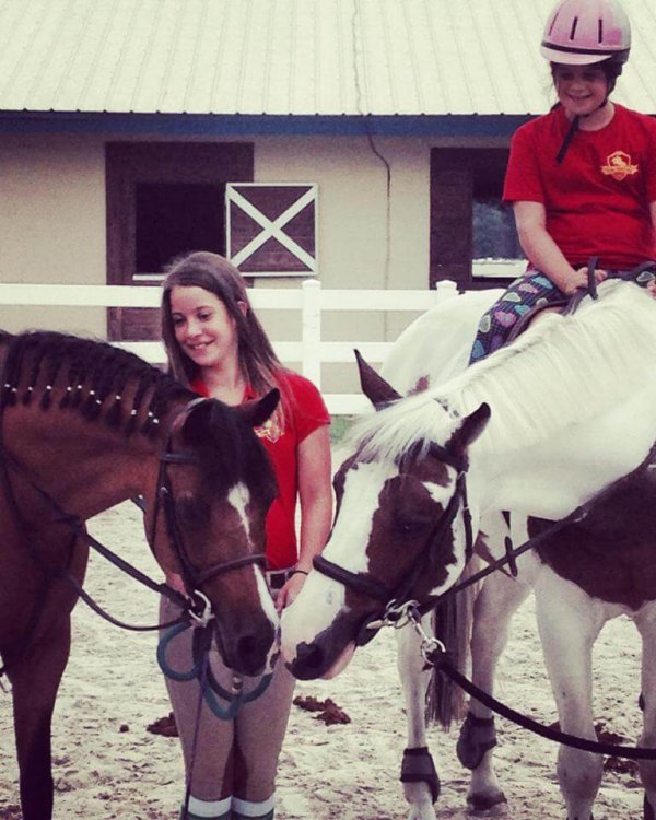 Kids riding horses at the Pine Hollow Camp