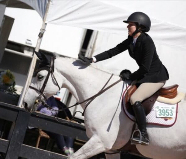 Equestrian on white horse