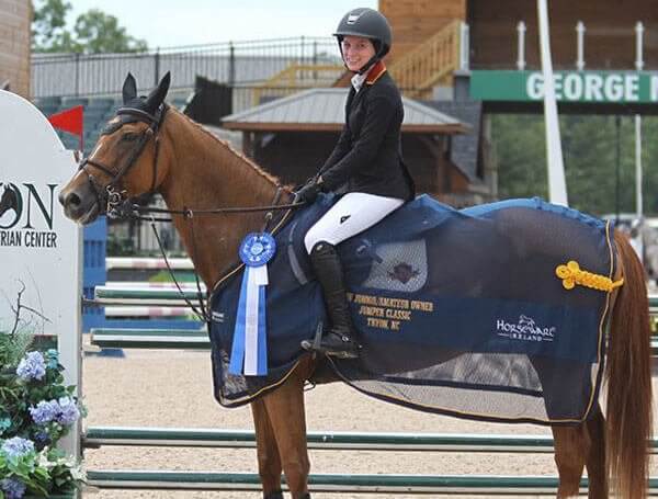 Carly and horse winning medal award