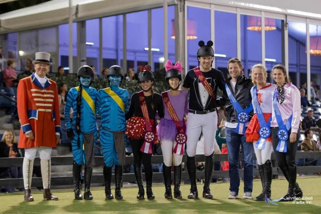 Group photo in Halloween costumes with ribbon awards